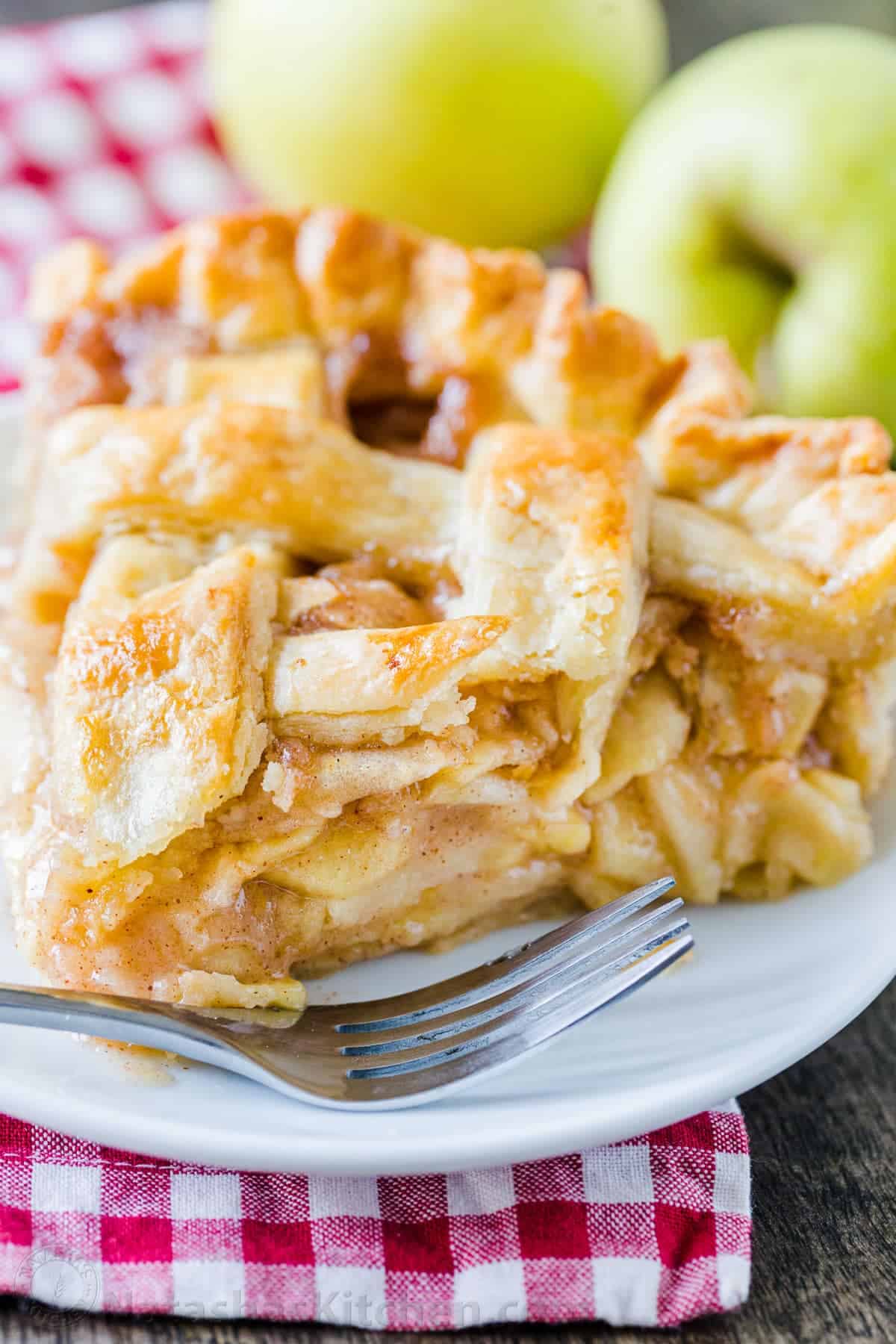 Classic American Fruit dessert slice on a white plate with fork 