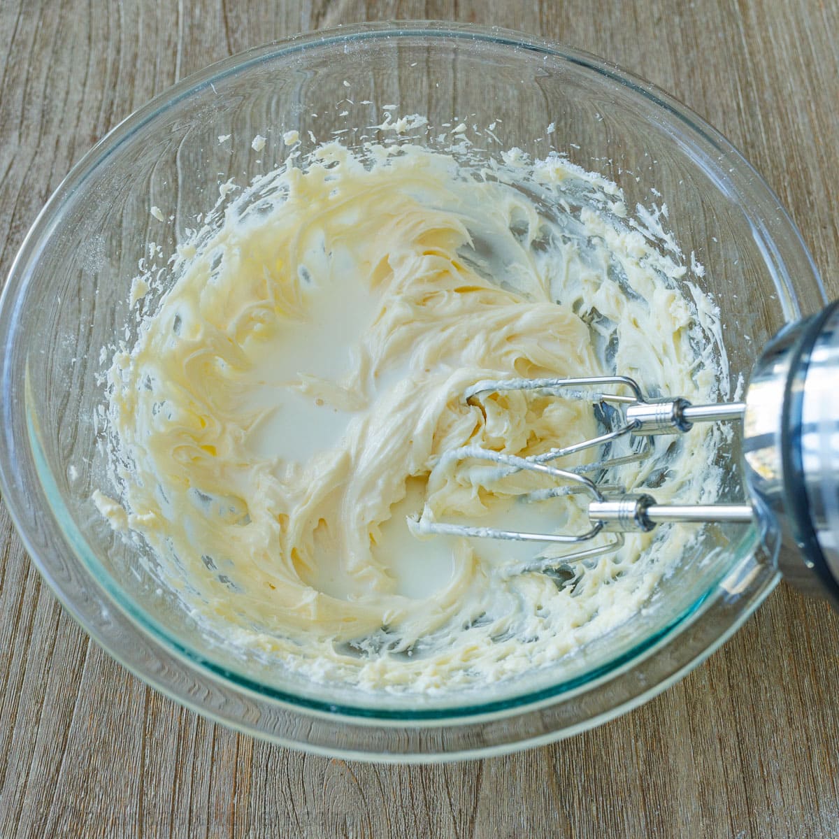 Mixing frosting using an electric mixer in a glass mixing bowl