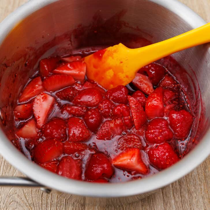 Cooked syrupy berry sauce in saucepan