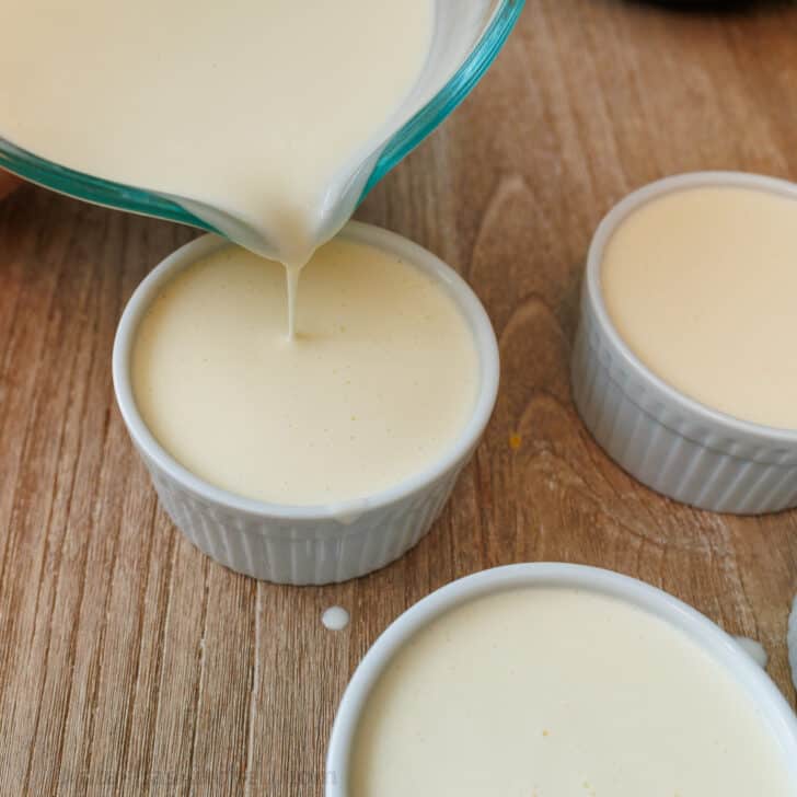 Pouring the Panna Cotta mix into ramekins