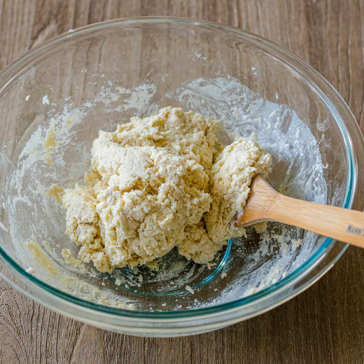 strawberry shortbread cake biscuit bough in a bowl with a spoon