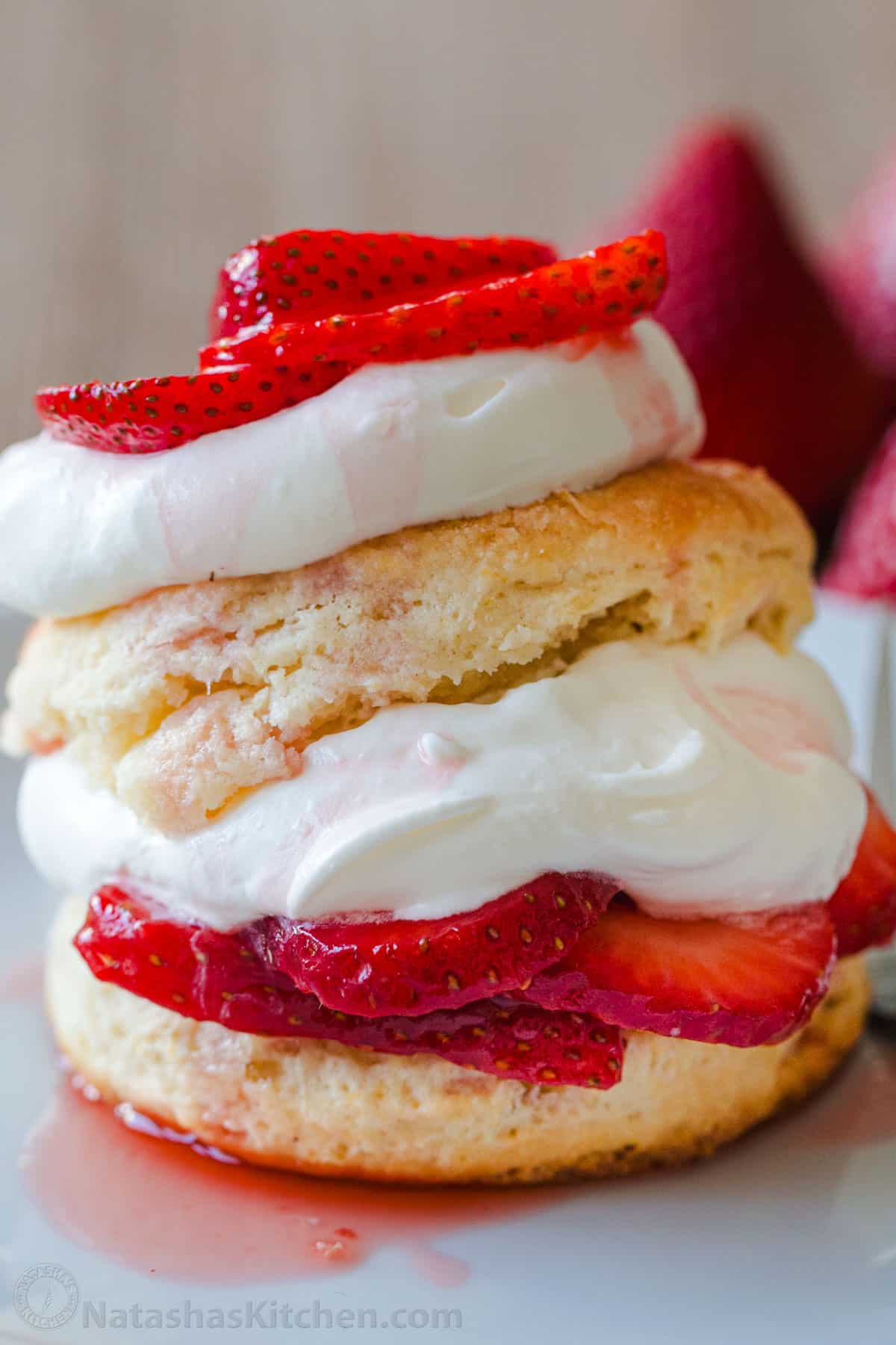 strawberry shortcake layered with homemade shortcake biscuits, macerated strawberries, and homemade whipped cream