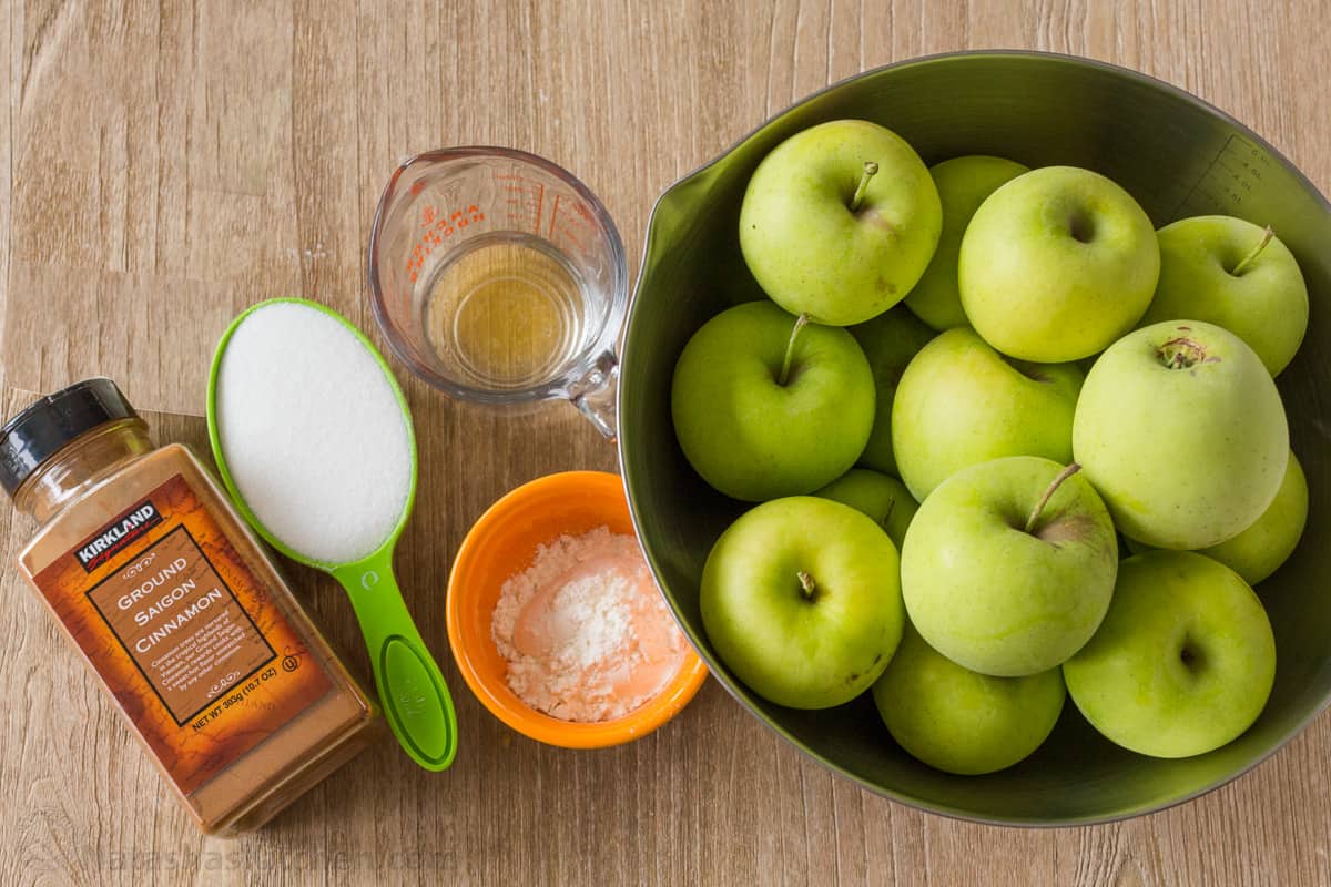 Ingredients for pie filling including lemon juice, sugar, cinnamon and flour