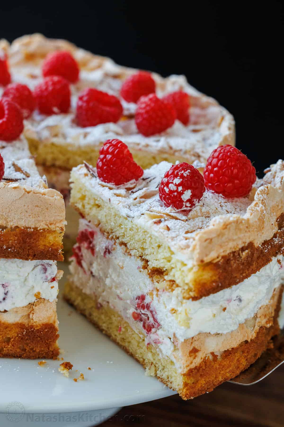 A slice of Himmelstorte being served on a cake platter